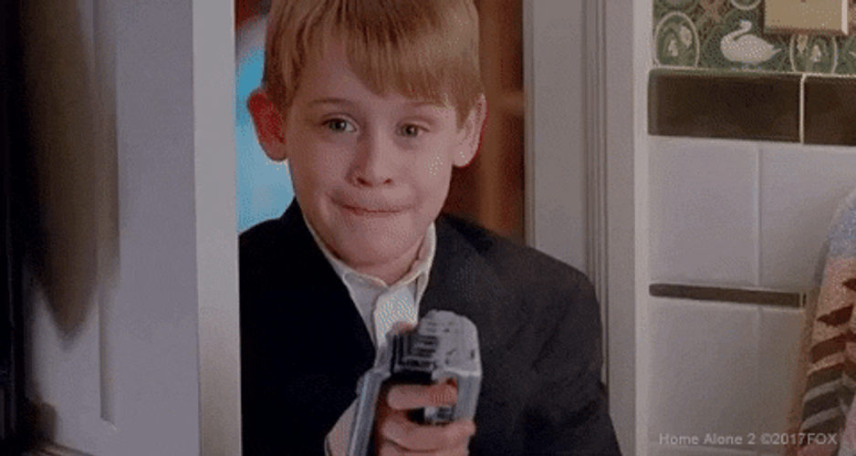 Kevin Laughing Secretly At Home Alone GIF