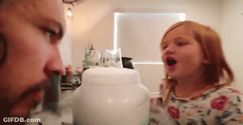 Kid Blow Smoke To Her Father GIF