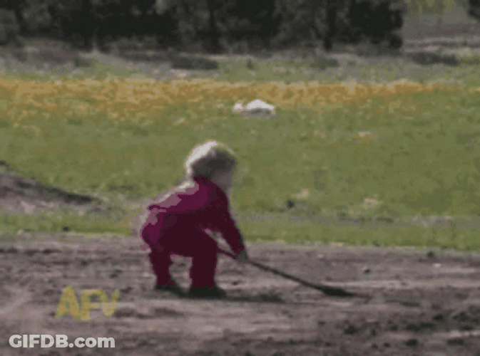 Kid Digging Spilling Soil In His Face GIF