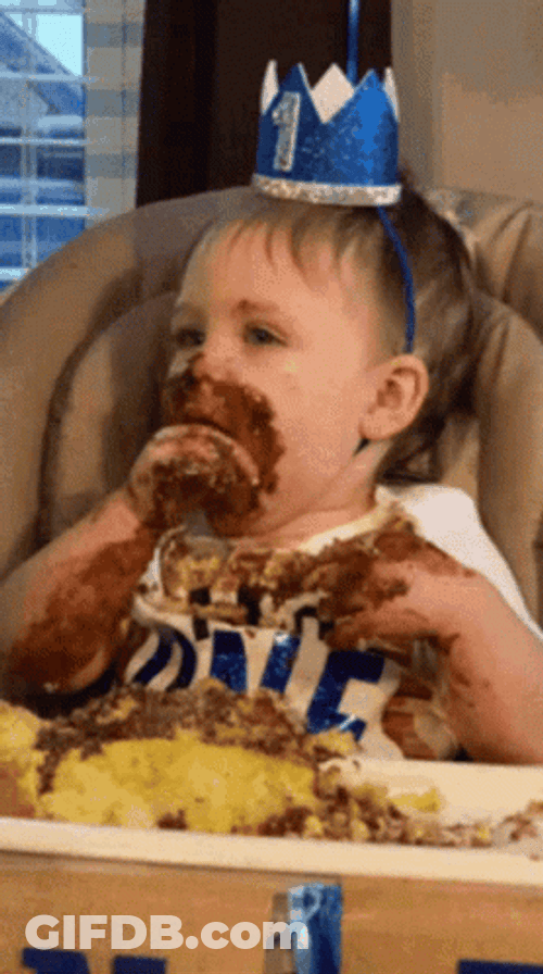 Kid Eating Cake All Over The Face GIF