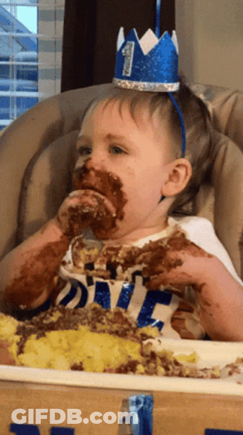 Kid Eating Cake With Hands GIF