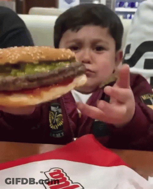 Kid Loving His Whataburger GIF
