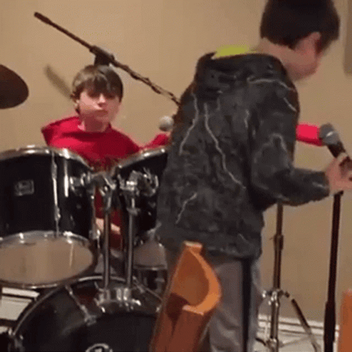 Kid Playing Rim Shot GIF