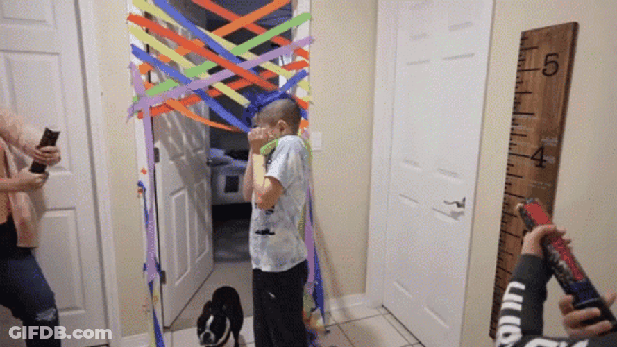 Kid Scared With Party Popper GIF