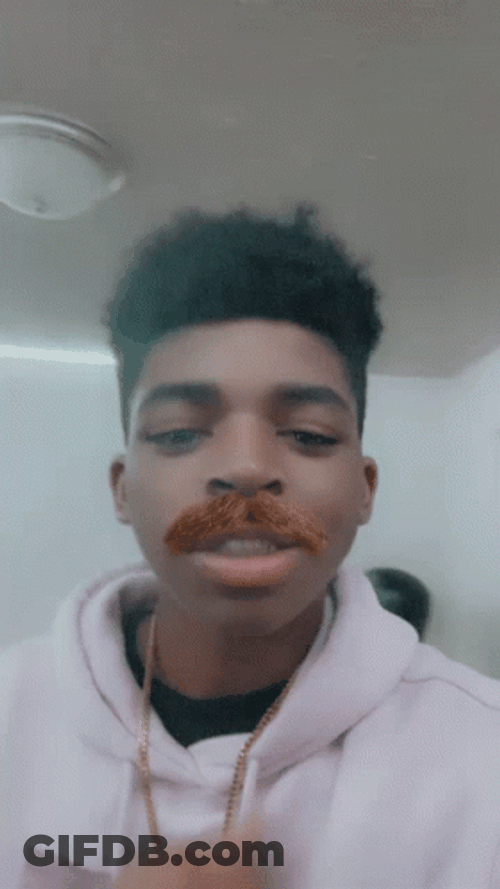 Kid Showing Fake Walrus Mustache GIF