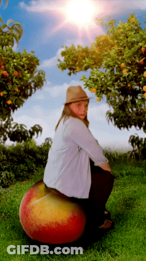 Kid Sitting On Bouncing Peach GIF