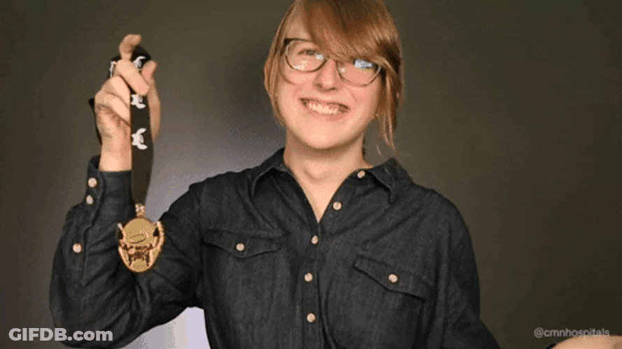 Kid Thumbs Up On Medal GIF