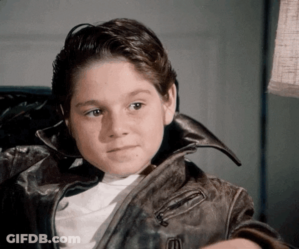Kid Wearing Jacket Agree While Seating GIF