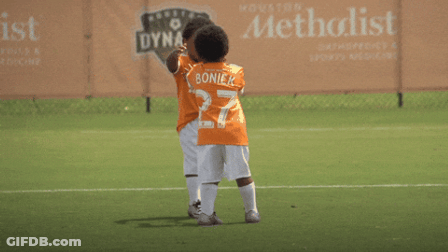 Kids Embracing Each Other In Field GIF