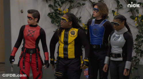 Kids In Superhero Costumes With Stop Sign GIF
