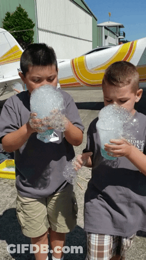 Kids Learning To Make Bubbles GIF