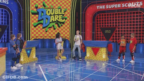 Kids Standing On Stage In Front Of Double Dare Sign GIF