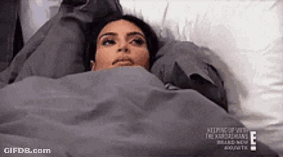 Kim Kardashian Thinking In Bed At Home GIF