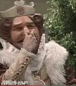 King Covering Mouth While Smoking GIF