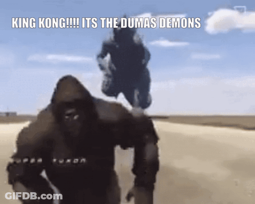 King Kong And Godzilla Are Walking Down A Dirt Road In The Desert . GIF