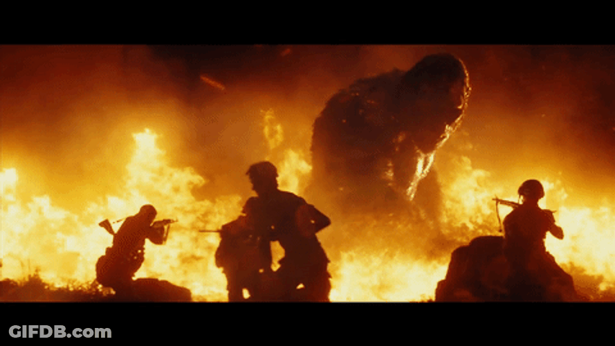 King Kong Fighting Soldiers On Burning Flames GIF