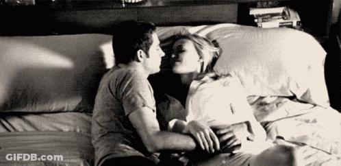 Kissing Couple On Bed In Black And White GIF