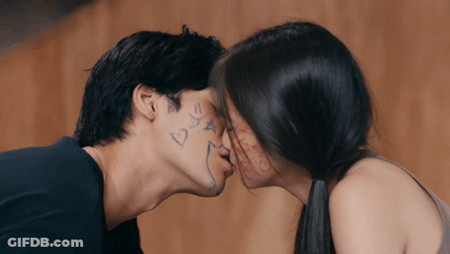 Kissing Man And Woman With Heart Faces GIF