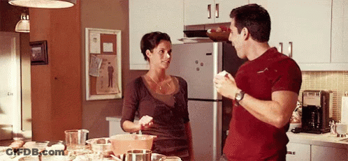 Kitchen With Clock Above Stove And Bosch Appliance GIF