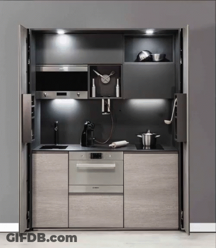 Kitchen With Clock Over Stove And Bosch Appliance GIF