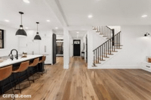 Kitchen With Hardwood Floors, Staircase, Bar GIF