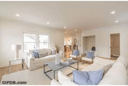 Kitchen With Stainless Steel Appliances And Blue Cabinets GIF