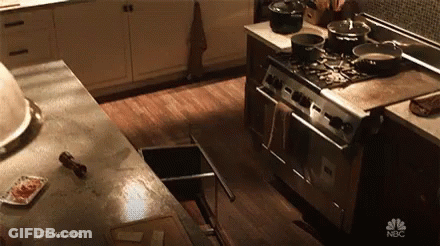Kitchen With Stove Sink And Timeless Advertisement GIF