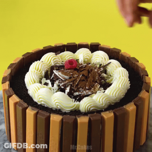 Kitkat Cake With Whipped Cream And Raspberries GIF
