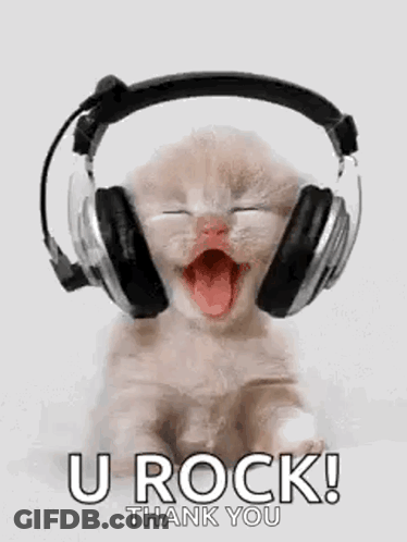 Kitten Wearing Headphones With Tongue Out GIF