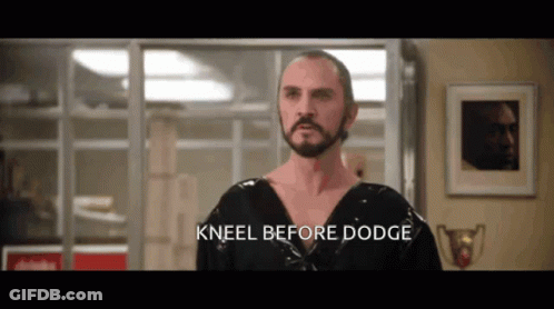 Kneeling Man With Beard And Dodge Words GIF