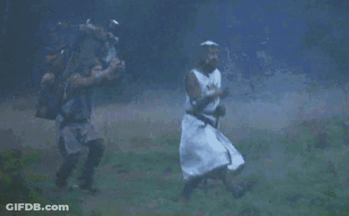 Knight Running In Field With Another Man GIF