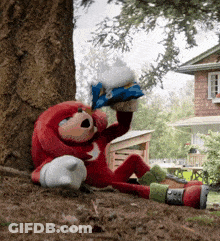 Knuckles The Echidna Is Laying Under A Tree Holding A Bag GIF