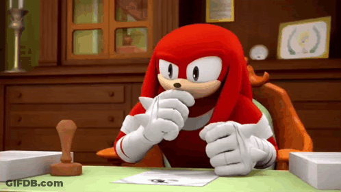 Knuckles The Echidna Sitting At Desk Holding Paper GIF