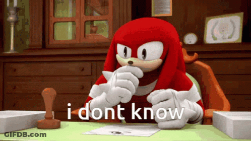 Knuckles The Echidna Sitting At Desk GIF