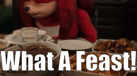 Knuckles The Hedgehog Is Sitting At A Table With Plates Of Food And The Words What A Feast GIF