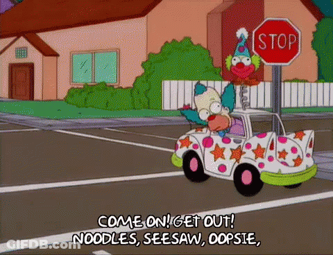 Krusty The Clown Is Driving A Car With A Stop Sign In The Background . GIF