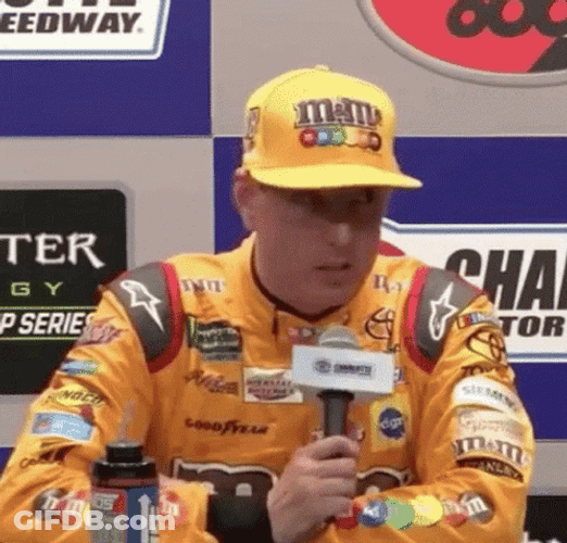 Kyle Busch Tossing Microphone Onto Table GIF