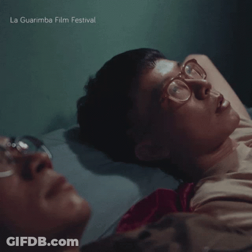 La Guarimba Film Festival Poster Two Men Laying On Bed GIF