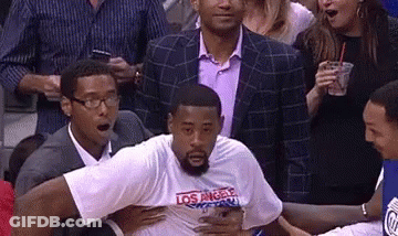 LA T-Shirt Man Held By Suit At Basketball Game GIF