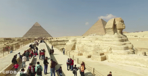 Lab Coat Man With Pyramid And Virusinstaller.com Logo GIF