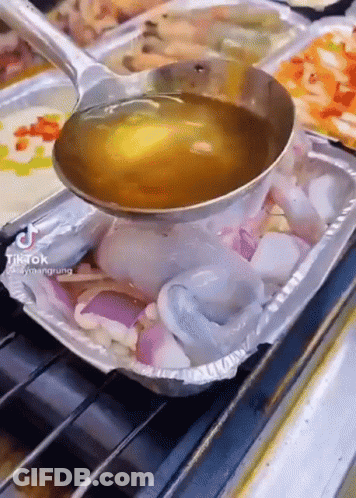 Ladle Pouring Liquid Into Food Tray GIF