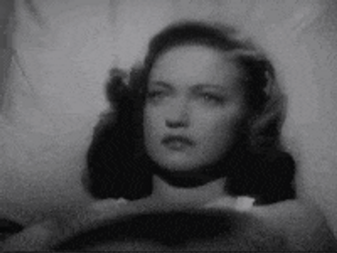 Lady Getting Hypnotize By Black Glass Necklace GIF