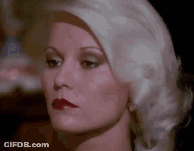 Lady Getting Hypnotized With A Necklace GIF