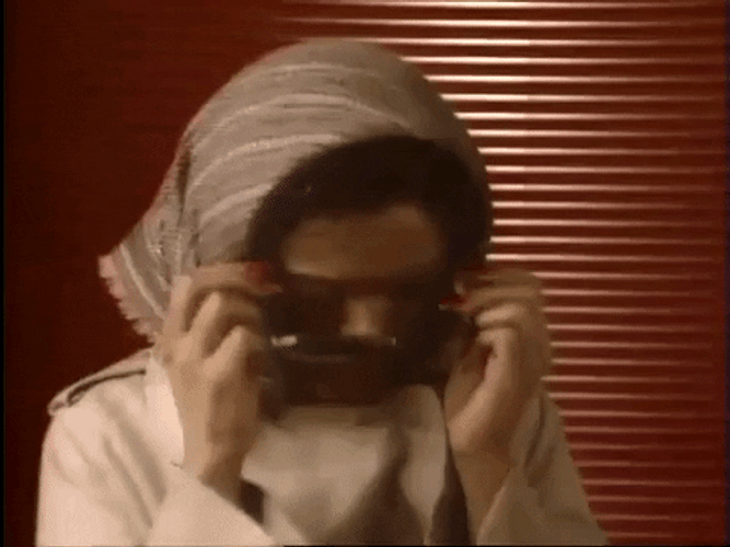 Lady Hiding With Sunglasses GIF