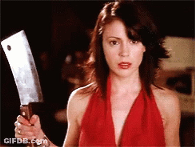 Lady Holds A Butcher Knife GIF