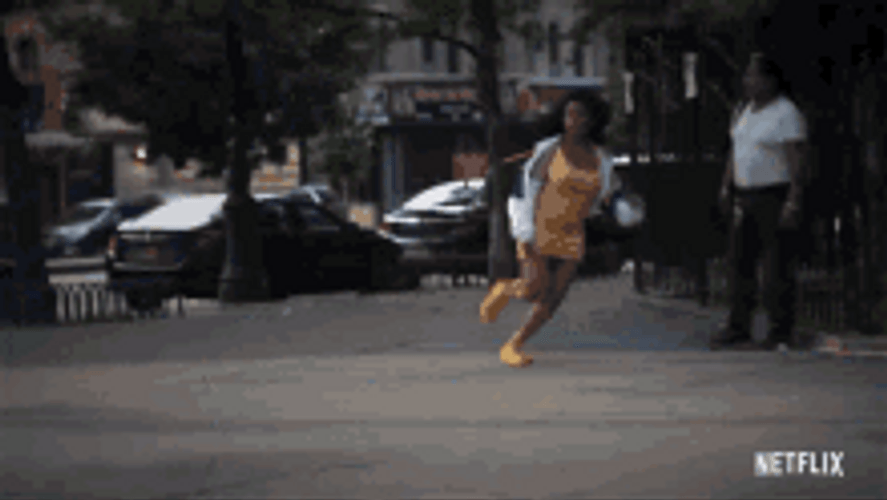 Lady Running Away Across The Street GIF