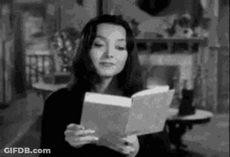 Lady Shocked Wide Eyes While Reading GIF