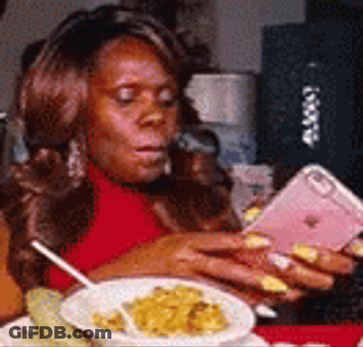 Lady Texting While Eating GIF