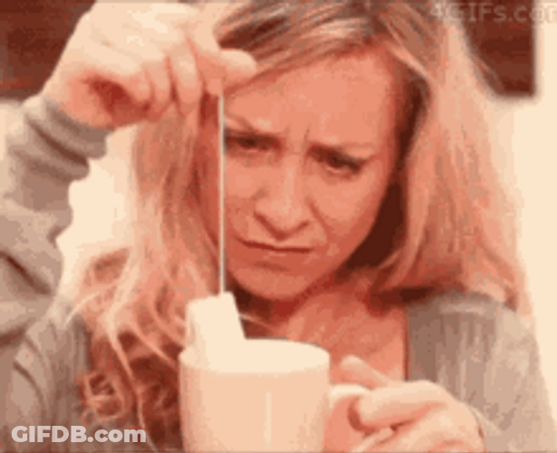 Lady Using Tampon As Tea Bag GIF