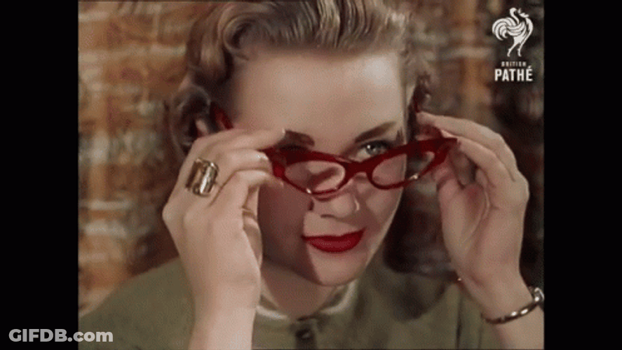 Lady Wearing Vintage Glasses GIF